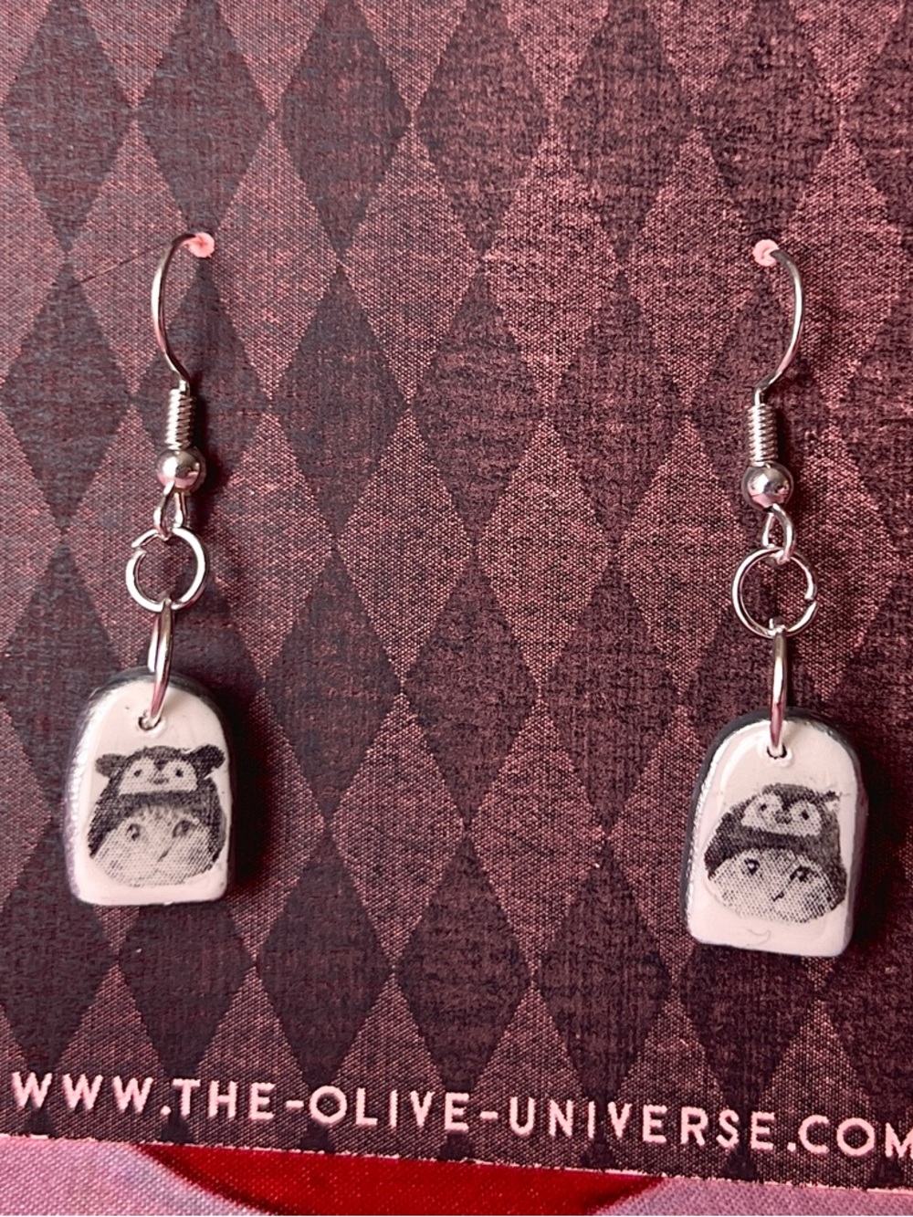 The Olive Universe Cozy Kitten Dangle Earrings in White and Black
